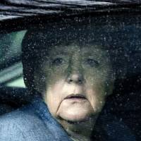 German Chancellor Angela Merkel arrives for an EU summit with six Eastern European partner countries at the European Council in Brussels on Friday. | AFP-JIJI