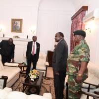 Zimbabwe President Robert Mugabe (second from left) meets with Father Fidelis Mukonori, Secretary to the Cabinet Dr. Misheck Sibanda and defense forces commander Gen. Constantino Chiwenga at State House in Harare on Nov. 19. | REUTERS