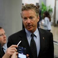 U.S. Sen. Rand Paul (R-KY) speaks with reporters about the withdrawn Republican health care bill on Capitol Hill in Washington in July. | REUTERS