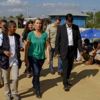 European Union foreign policy chief Federica Mogherini (center) visits the Kutupalong Rohingya refugee camp in Cox\'s Bazar, Bangladesh, Sunday. More than 600,000 Rohingya Muslims have fled Rakhine for neighboring Bangladesh since late August, when the military launched what it called \"clearance operations\" in response to insurgent attacks. | AP