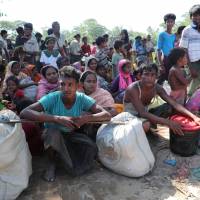Rohingya refugees who crossed the border are temporarily detained by Border Guard Bangladesh (BGB) in Cox\'s Bazar, Bangladesh, Sunday. | REUTERS