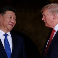 U.S. President Donald Trump welcomes Chinese leader Xi Jinping at Trump\'s Mar-a-Lago estate in Palm Beach, Florida, in April. | REUTERS