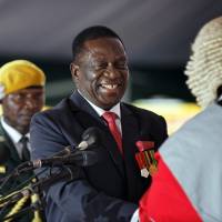 Emmerson Mnangagwa is sworn in as Zimbabwe\'s new president during the inauguration ceremony in Harare, Zimbabwe, on Friday. | AP