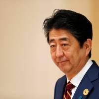 Prime Minister Shinzo Abe appears in Danang, Vietnam, on Saturday. On Sunday he met with James Soong, Taiwan\'s special envoy to the Asia-Pacific Economic Cooperation leaders\' meeting. | REUTERS