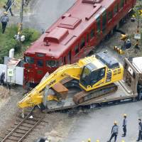 A tourist train on the JR Hisatsu Line crashes into a truck in Yatsushiro, Kumamoto Prefecture, on Friday. | KYODO