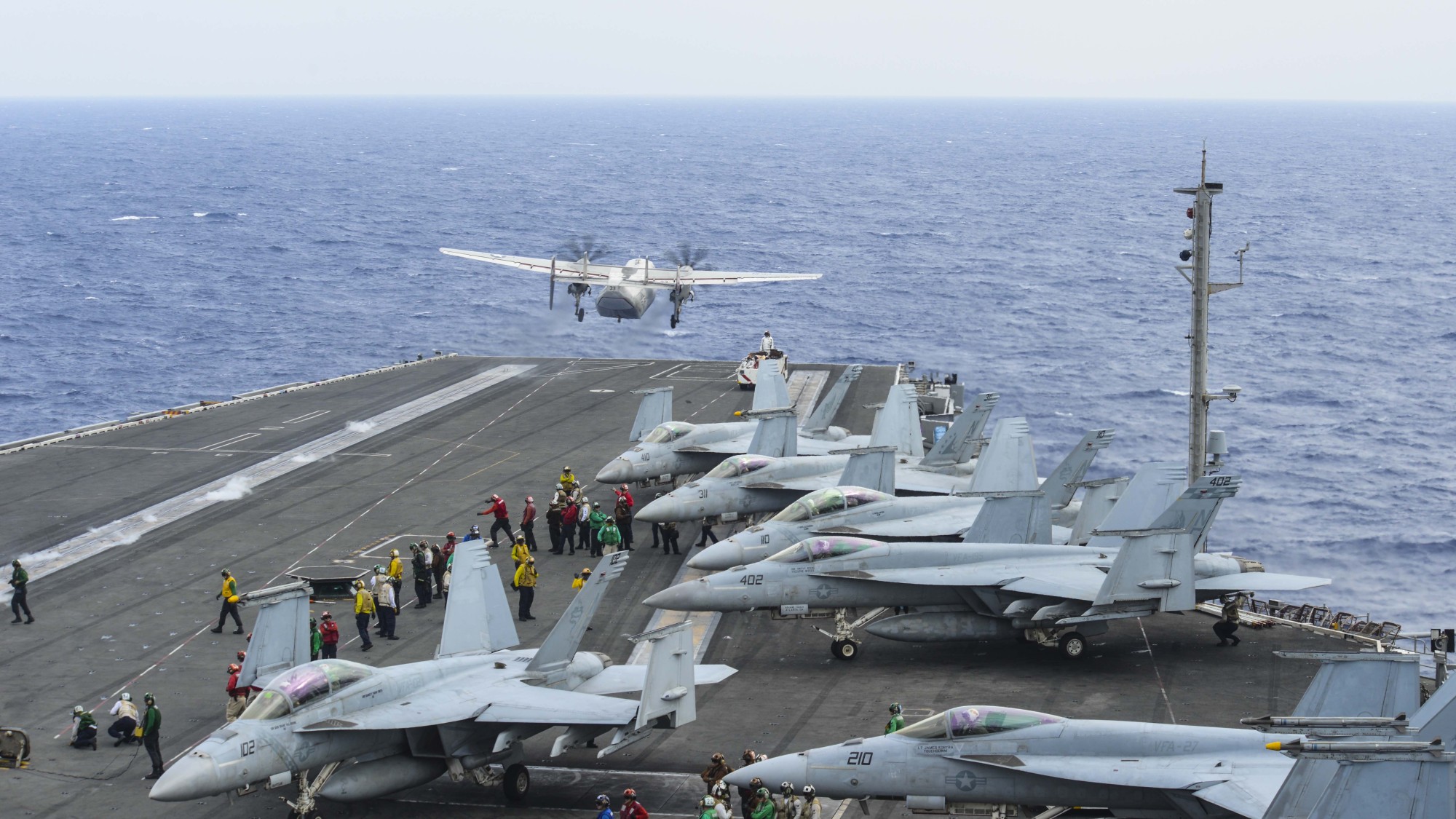 A C-2A transport plane launches from the flight deck of the U.S. Navy's forward-deployed aircraft carrier and flagship of Carrier Strike Group five, the aircraft carrier USS Ronald Reagan on Nov. 17. | U.S. NAVY