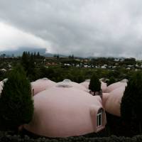 Quake-resistant domed houses made of polystyrene in Aso, Kumamoto Prefecture, are drawing visitors from Asia. | REUTERS