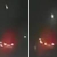 A fireball descends and disappears in a flash at around 9:30 p.m. on Tuesday in images recorded from Namegawa, Saitama Prefecture. The red glow and lights beneath it are car tail lights. | KYODO