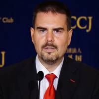 Glen Wood, an equity sales manager at Mitsubishi UFJ Morgan Stanley Securities Co., speaks about the issues he has faced, at the Foreign Correspondents\' Club of Japan in Tokyo on Thursday. | MAGDALENA OSUMI