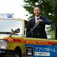 Ichiro Kawanabe, chairman of Nihon Kotsu Co., poses for a photograph in Tokyo on Sept. 15. Kawanabe is aiming to shake up his own ¥1.72 trillion ($15 billion) industry with a taxi-hailing app. He also plans to offer fixed-rate pricing and carpooling. | BLOOMBERG