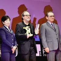 Turkish director Semih Kaplanoglu (third from left), winner of the Grand Prize at the Tokyo International Film Festival, poses with Tokyo Gov. Yuriko Koike and Tommy Lee Jones, who is the head of the Competition jury, in Roppongi on Friday. | YOSHIAKI MIURA