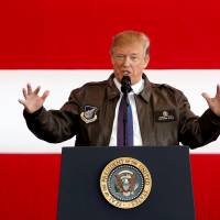 U.S. President Donald Trump addresses members of U.S. military services and Japan Self-Defense Force (JSDF) at U.S. Air Force Yokota Air Base on Sunday morning.  | REUTERS