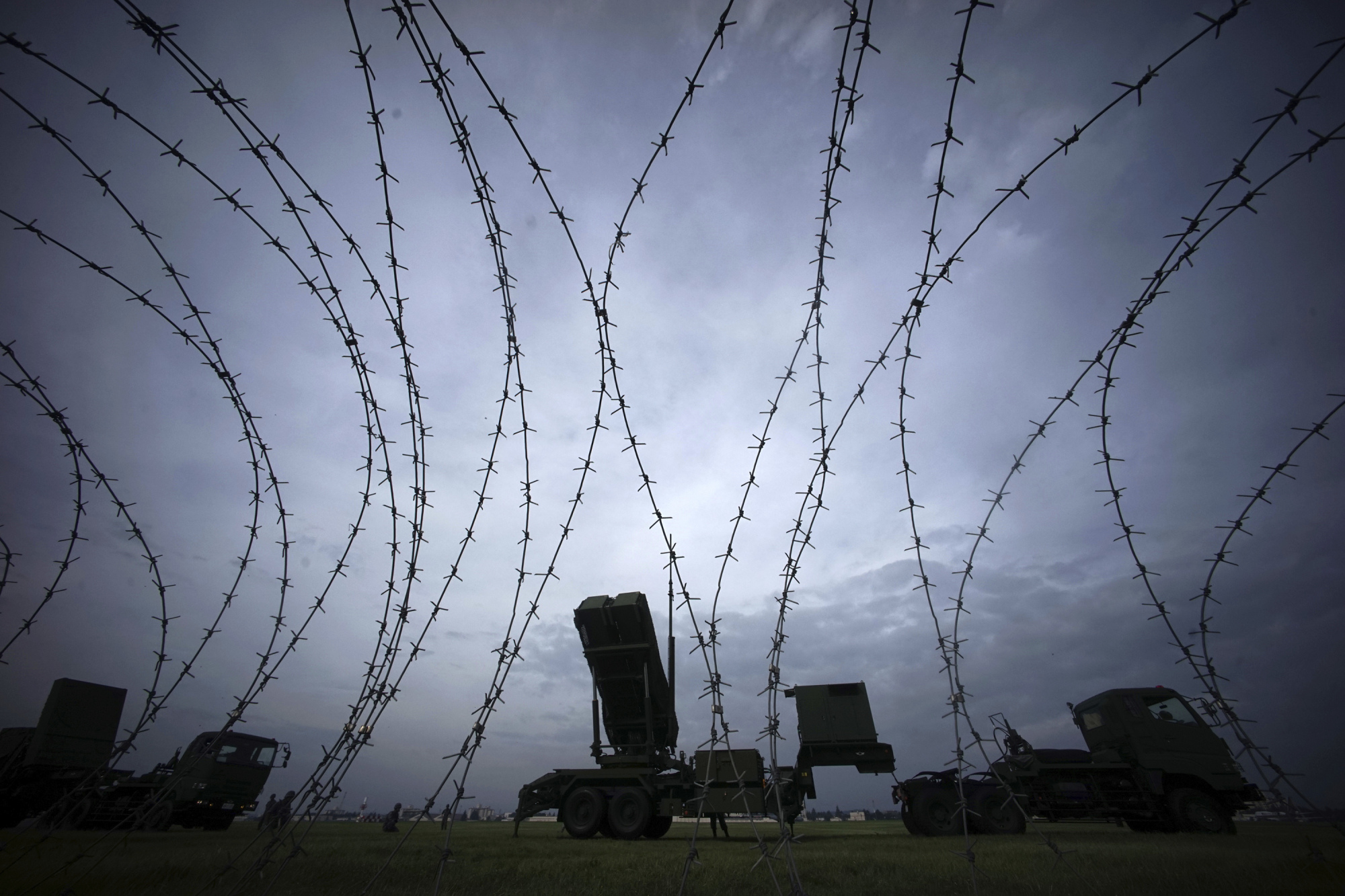 Air Self-Defense Force members demonstrate the PAC-3 surface-to-air interceptors at the U.S. Yokota Air Base in Fussa, on the outskirts of Tokyo, on Aug. 29. | AP