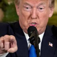 U.S. President Donald Trump speaks during a meeting with American and Japanese business leaders at the U.S. ambassador’s residence in Tokyo on Monday. | AP