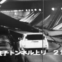 The collapsed ceiling in Sasago Tunnel on the Chuo Expressway can be seen on a Central Nippon Expressway Co. monitor in December 2012. | KYODO