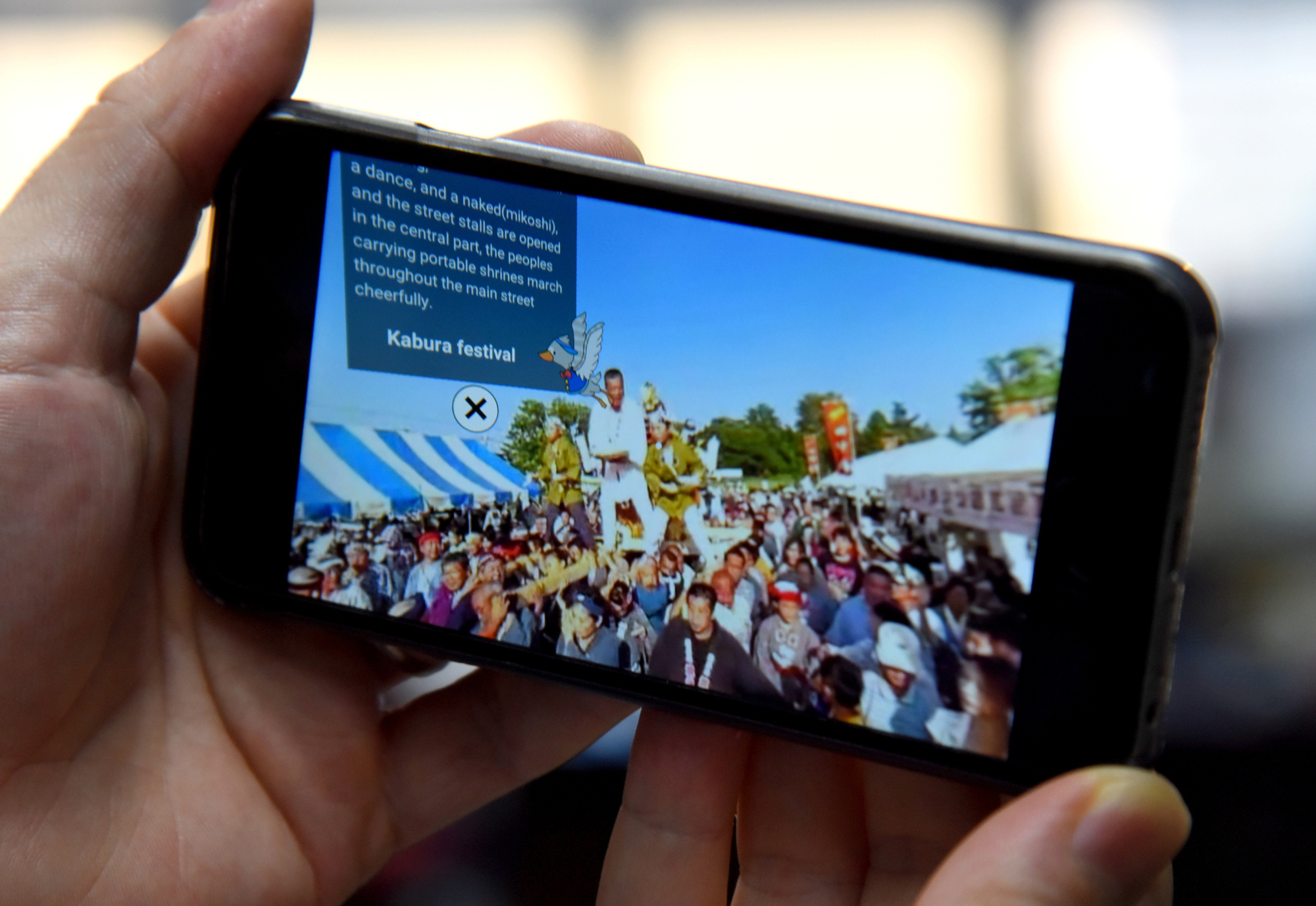 A scene from the Kabura festival is displayed on the Bibai City VR iPhone app. | SATOKO KAWASAKI