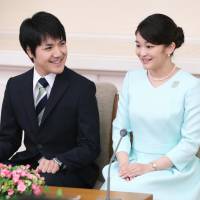 Princess Mako and Kei Komuro speak with reporters in Tokyo\'s Akasaka district on Sept. 3. The Imperial Household Agency has announced that they will be married on Nov. 4 next year. | KYODO