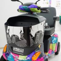 A prototype electric wheelchair jointly created by carmaker Suzuki Motor Corp., artists and people with disabilities is displayed at Super Welfare Expo on Nov. 10 in Tokyo\'s Shibuya Ward. | MAGDALENA OSUMI