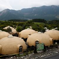 Quake-resistant dome houses at the Aso Farm Land. | REUTERS