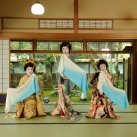A former tomesode of Ryuto Shinko (center) and two furisode make waves with towels in Niigata Prefecture. | COURTESY OF DAIICHI PRINTING CO.