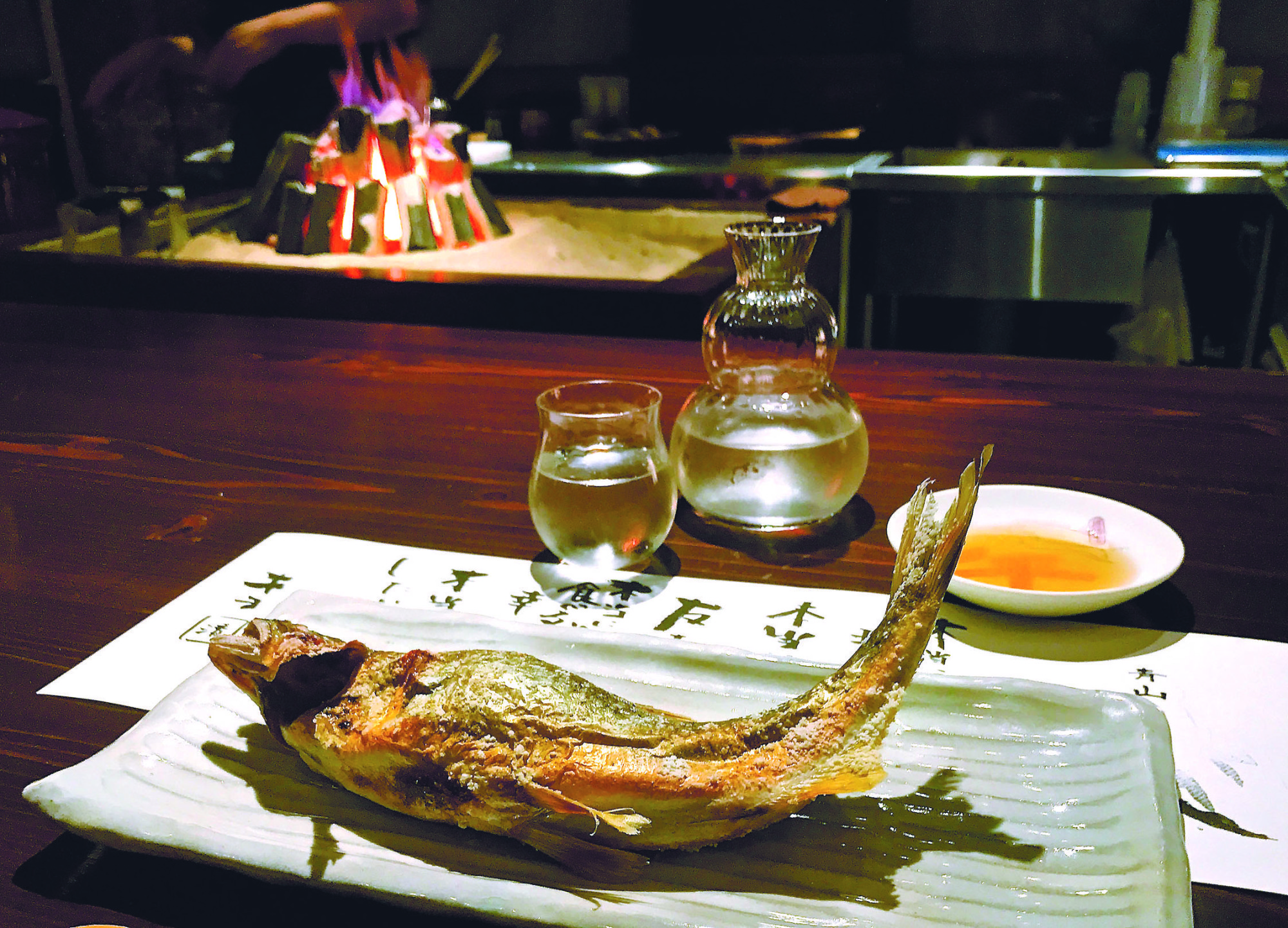 Sweetfish straight from the grill at Tadenoha in Tokyo's Minami-Aoyama. | ROBBIE SWINNERTON