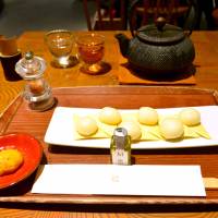 Mochi masters: At Taneya, an order of sticky rice cakes on crackers comes with a wee bottle of extra virgin olive oil and a soy sauce-flavored mousse. | J.J. O\'DONOGHUE