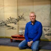 Hail, seiza: Author and self-confessed \"public works consultant\" Alex Kerr sits seiza-style in his living room in Kameoka, Kyoto Prefecture. \"You know, my moment came,\" he says. \"It\'s not at an opportune time, but it came and now I need to go through with it.\" | J.J. O\'DONOGHUE