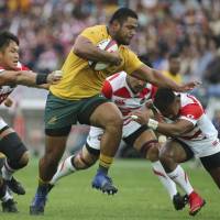 Australia\'s Scott Sio runs with the ball during Saturday\'s test match against Japan in Yokohama. | AP