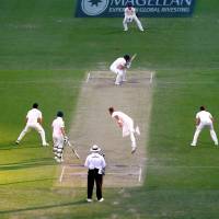 England\'s Stuart Broad bowls a short delivery to Australia\'s Shaun Marsh on Friday during the final over of the second day of the first Ashes test in Brisbane, Australia. | REUTERS