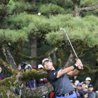 Hideki Matsuyama hits from the rough during the third round of the Dunlop Phoenix on Saturday in Miyazaki. | KYODO