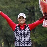 Ai Suzuki celebrates after clinching the Japan LPGA Tour money title on Sunday. | KYODO