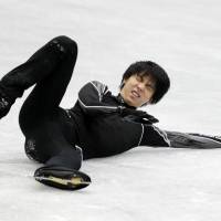 Yuzuru Hanyu grimaces after falling in practice on Thursday ahead of the NHK Trophy in Osaka. | AFP-JIJI