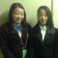 Rika Kihira (left) and Riko Takino pose for a photo on Friday at Gunma Ice Arena. They will compete at the Japan Junior Championships this weekend. | JACK GALLAGHER