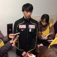 Mitsuki Sumoto talks to the media after his short program on Saturday. Sumoto is in first place with 67.34 points. | JACK GALLAGHER