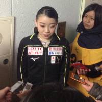 Rika Kihira speaks to reporters after the women\'s short program on Saturday. Kihira is in sixth place with 57.89 points. | JACK GALLAGHER