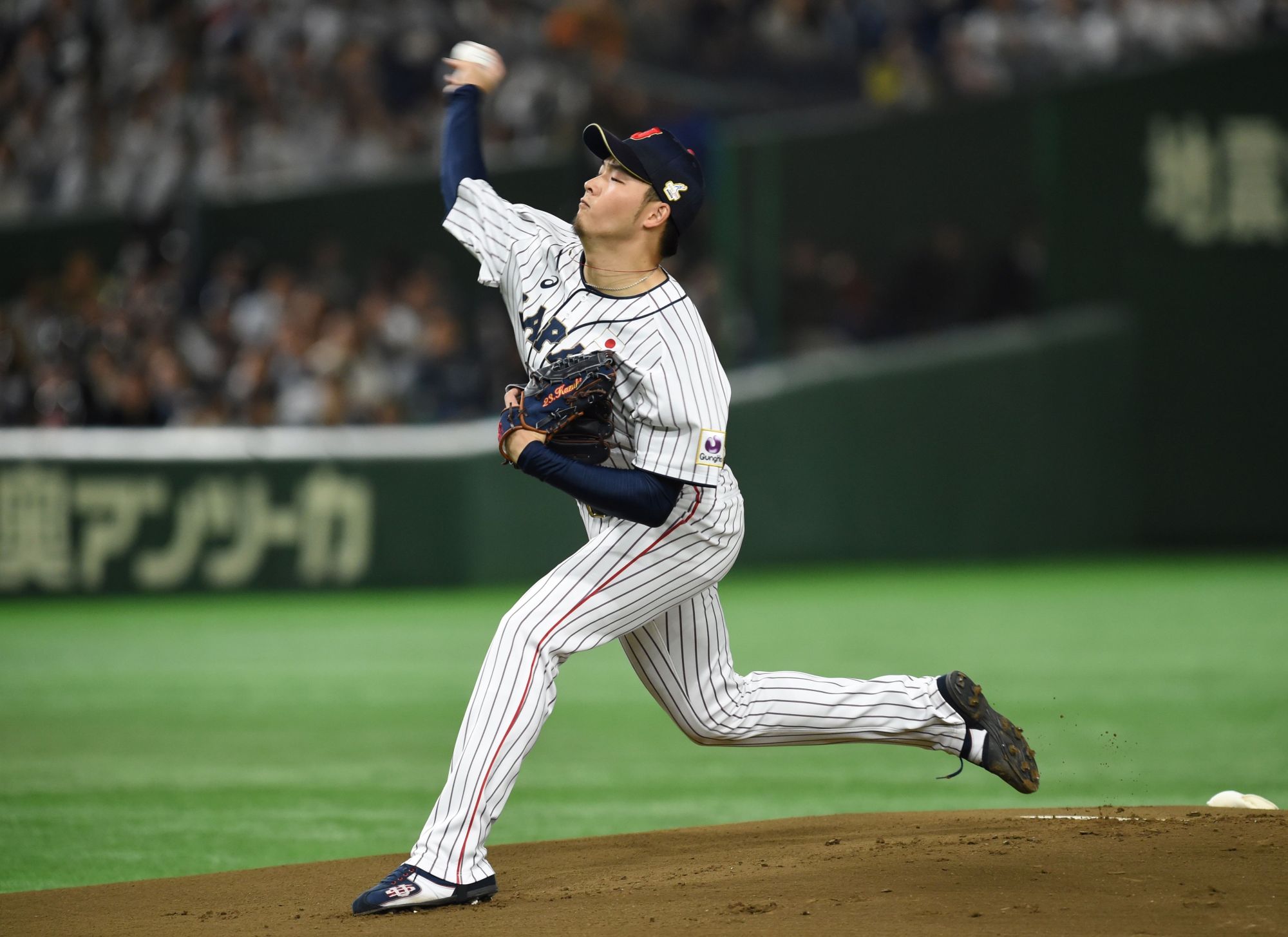 Japan starter Kazuki Yabuta pitches against South Korea in the first inning of an Asia Professional Baseball Championship preliminary round game at Tokyo Dome on Thursday. | AFP-JIJI
