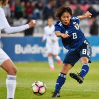 Nadeshiko Japan\'s Mana Iwabuchi scores one of her two first-half goals against Jordan in a friendly on Friday in Amman. Japan won 2-0. | KYODO