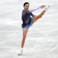 Russia\'s Evgenia Medvedeva skates in the short program at the NHK Trophy on Friday at Osaka Municipal Central Gymnasium. Medvedeva leads the field with 79.99 points. | REUTERS