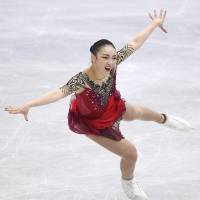 Rika Hongo competes during the women\'s short program on Friday. She is in fourth place (65.17 points) heading into Saturday\'s free skate. | KYODO