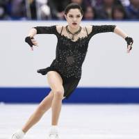 Two-time world champion Evgenia Medvedeva dazzles the crowd during Saturday\'s free skate at the NHK Trophy. The Russian, who led the field after the short program, won the two-day competition with 224.39 points at Osaka Municipal Central Gymnasium. | KYODO