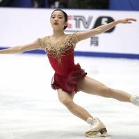 Marin Honda performs her free skate routine at the Cup of China on Saturday in Beijing. Honda finished fifth in the two-day women\'s competition. | AP
