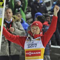 Junshiro Kobayashi celebrates after his first victory at the 2017-18 FIS Ski Jumping World Cup on Sunday in Wisla, Poland. | AP