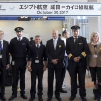 Egyptian Ambassador Ayman Kamel (center) poses with EgyptAir staff at Narita Airport on Oct. 30 during a ceremony to mark the resumption of flights between Cairo and Tokyo. | COURTESY OF EGYPTIAN EMBASSY