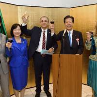Algerian Ambassador Mohamed El Amine Bencherif (center) leads a toast with (from left) Mitsunari Okamoto, parliamentary vice-minister for foreign affairs; Sanae Yamaguchi; Komeito leader Natsuo Yamaguchi; and the ambassador\'s wife, Amira, during a reception to celebrate the country\'s national day at the embassy in Tokyo on Nov. 10. | YOSHIAKI MIURA