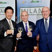 Alitalia Regional General Manager for Asia-Pacific Massimo Allegri (right) joins Italian Ambassador Giorgio Starace (center) and Lower House lawmaker Shintaro Ito during a reception to celebrate the 70th anniversary of the airline\'s first national flight at the Italian ambassador\'s residence in Tokyo on Tuesday. | YOSHIAKI MIURA