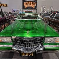 A bright green lowrider car goes on display at the Lowrider Super Show at Makuhari Messe in Chiba Prefecture on Nov. 19. Japan\'s lowrider enthusiasts have been buying and customizing the cars, which can cost over &#165;10 million, for the last 30 years. | YOSHIAKI MIURA