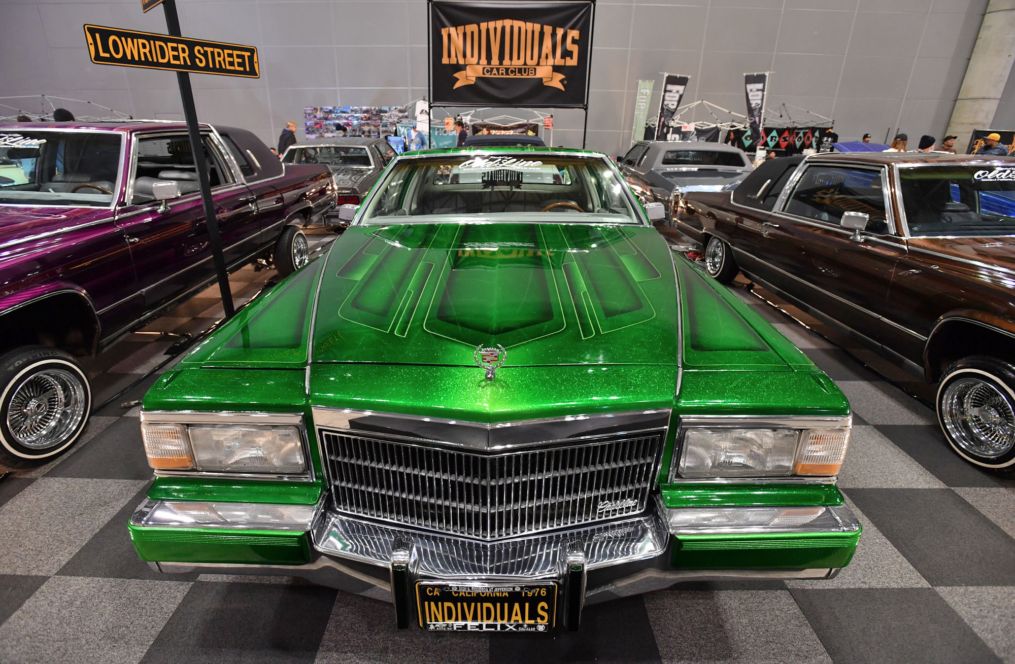 A bright green lowrider car goes on display at the Lowrider Super Show at Makuhari Messe in Chiba Prefecture on Nov. 19. Japan's lowrider enthusiasts have been buying and customizing the cars, which can cost over &#165;10 million, for the last 30 years. | YOSHIAKI MIURA