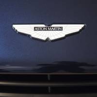 The Aston Martin logo is seen on the hood of a Vanquish luxury automobile displayed at a showroom in Singapore. | BLOOMBERG