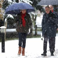 British Prime Minister Theresa May and her husband, Philip leave church in Sonning, Britain, Sunday. | REUTERS