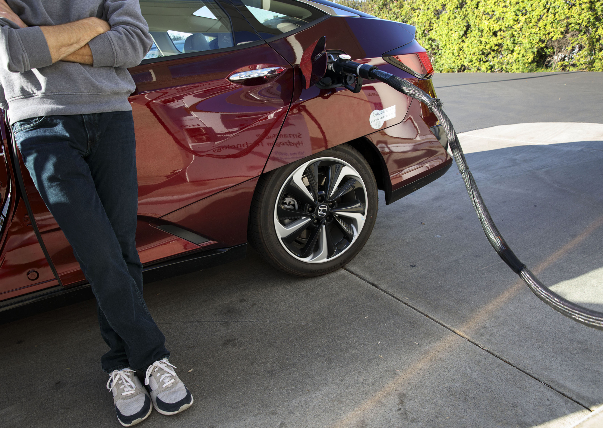 A customer refuels a Honda Motor Co. Clarity hydrogen fuel-cell vehicle at the UC Irvine Hydrogen Fueling Station, operated by the National Fuel Cell Research Center (NFCRC), in Irvine, California, in February. | BLOOMBERG